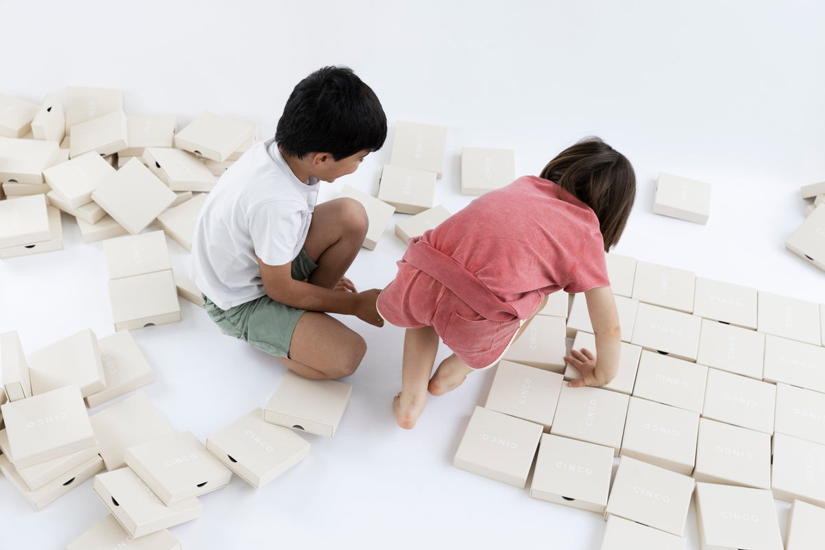 Children organizing CINCO Jewelry boxes, promoting a fun back to school tips for parents experience.