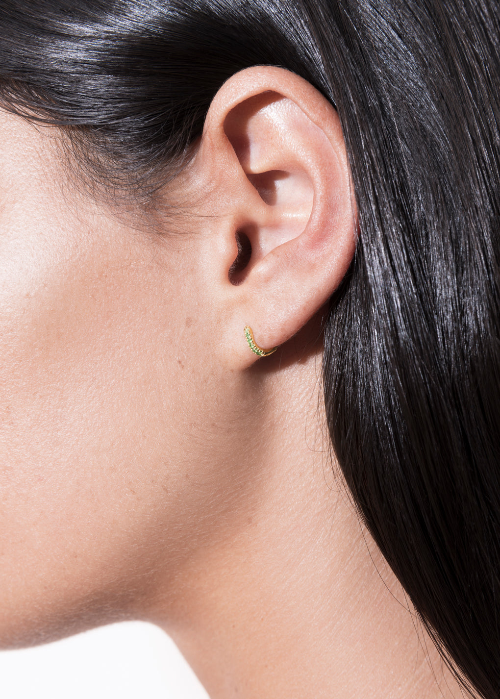 model wearing cate hoop 18k emerald