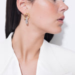 model wearing gilda two tone earrings