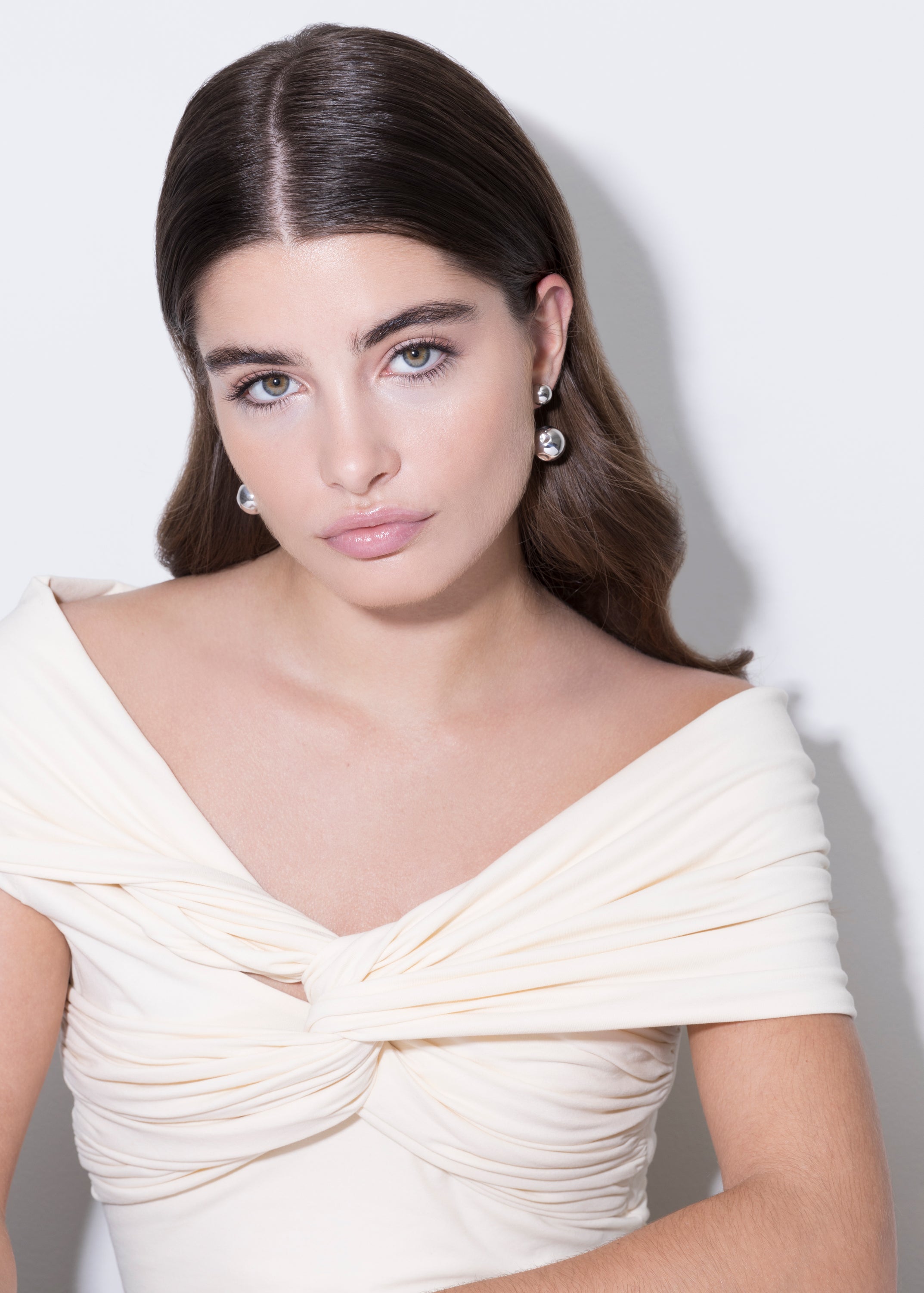 model wearing pamela earrings in silver