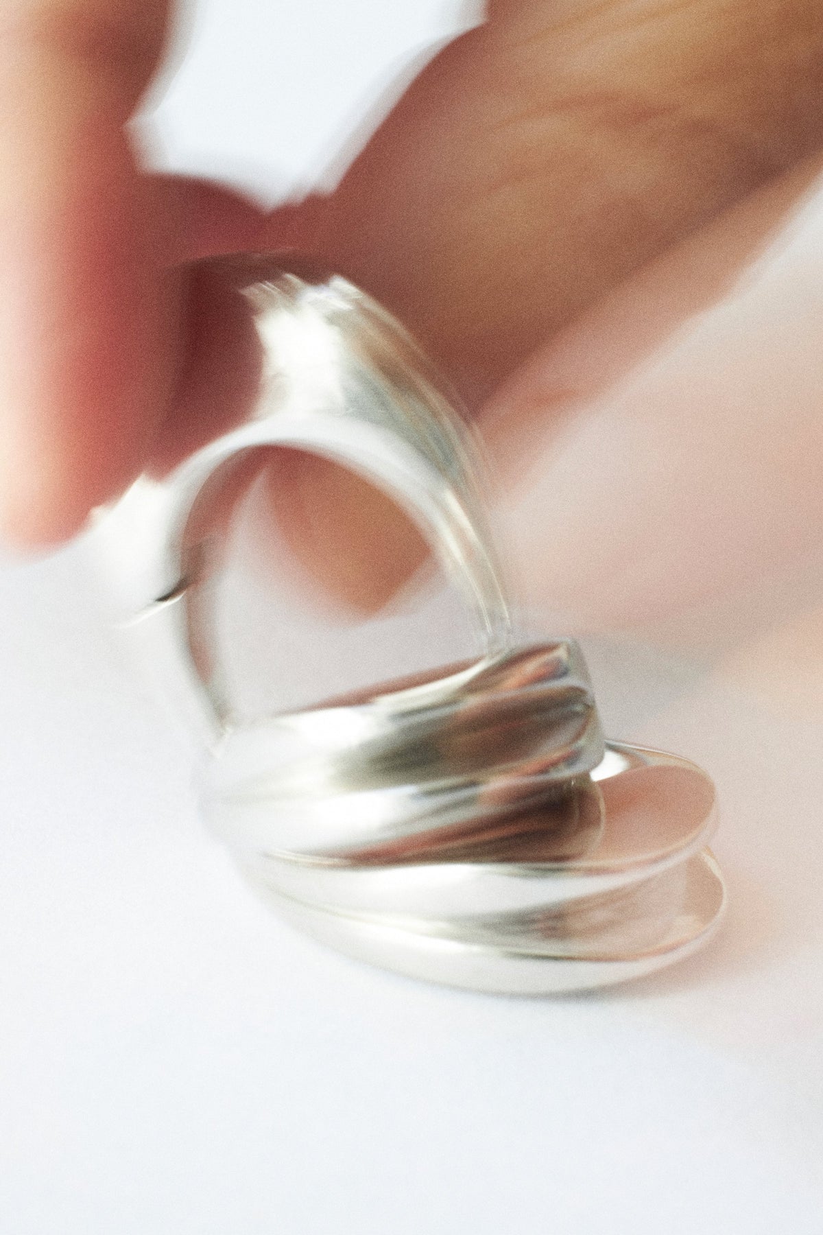 Spinning silver rings showcasing self-gifting jewelry designed for personal expression and style.