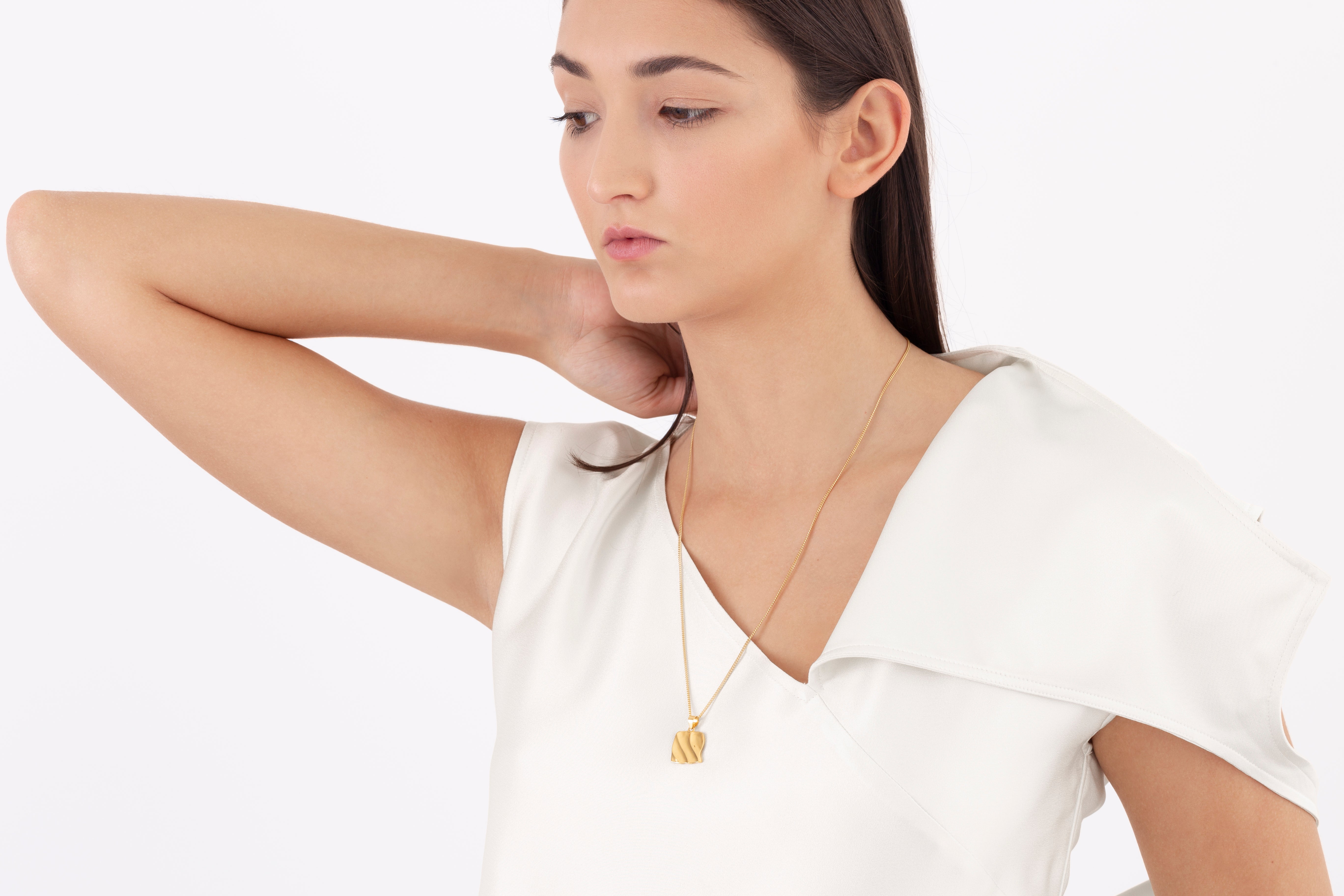 model wearing mira necklace in gold