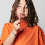 model wearing necklace alphabet with letter D in silver and kids bracelet with letter M and C in silver