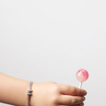 model wearing kids bracelet with letter M in silver