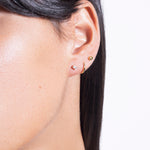 model wearing (non)sphere earrings 18k, seamless hoop 18k and earring starter 08 diamond