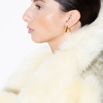 model wearing blake earrings in gold