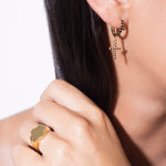 model wearing keya ring and sascha earrings black in gold