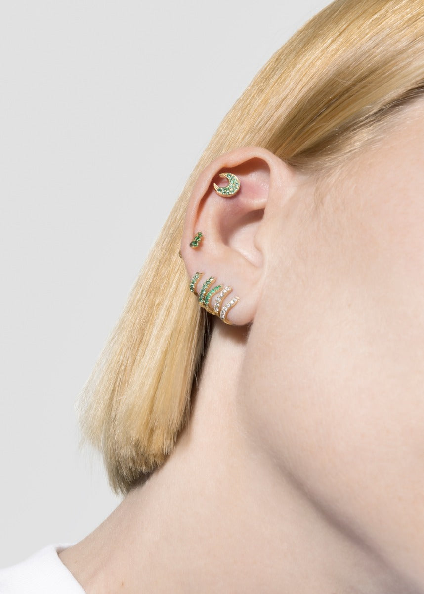 model wearing mush stud 18k emerald