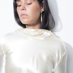 model wearing sade earrings in gold