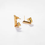 tina huggies earrings