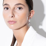 model wearing tina earrings in silver