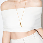 model wearing val necklace in gold